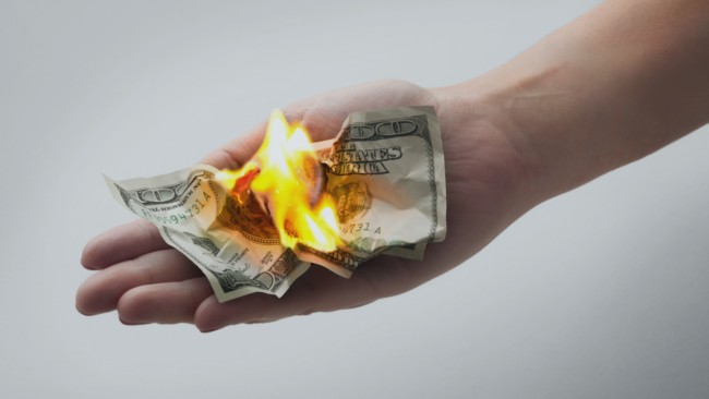 image of one hundred dollar bill burning