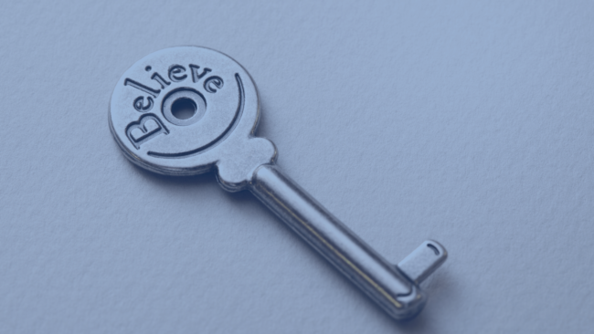 Image with key engraved with the word believe