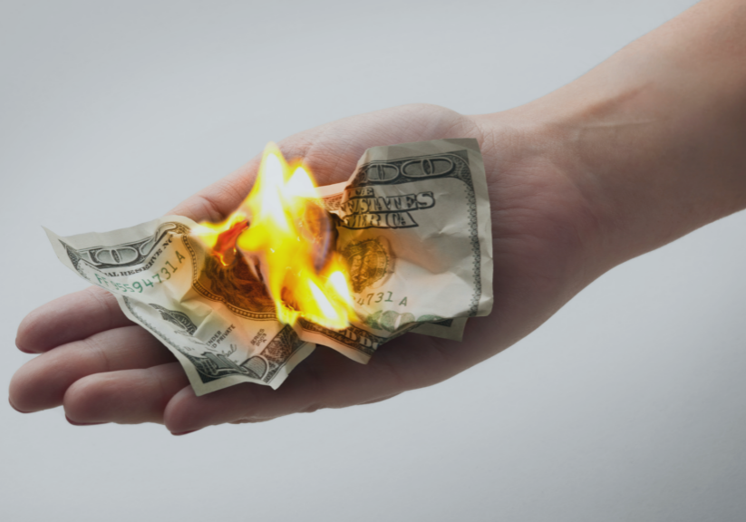 image of one hundred dollar bill burning