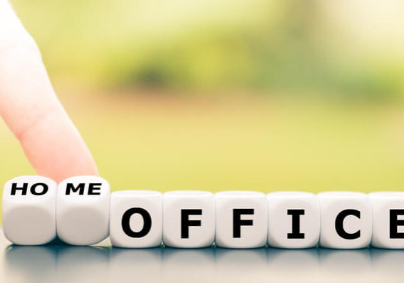 Be in home office during the corona crisis. Hand turns dice and changes the expression "office" to "home office".